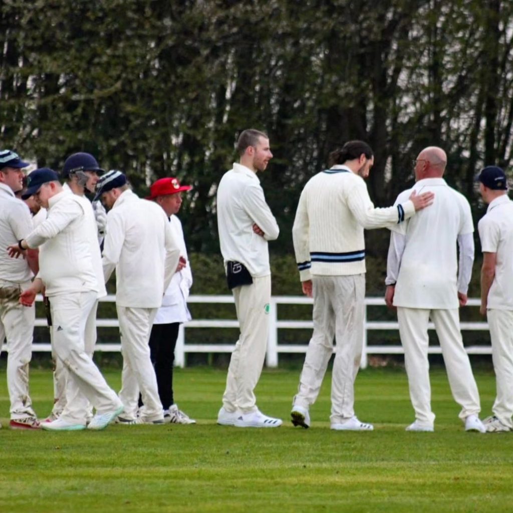 Team huddle after taking a wicket